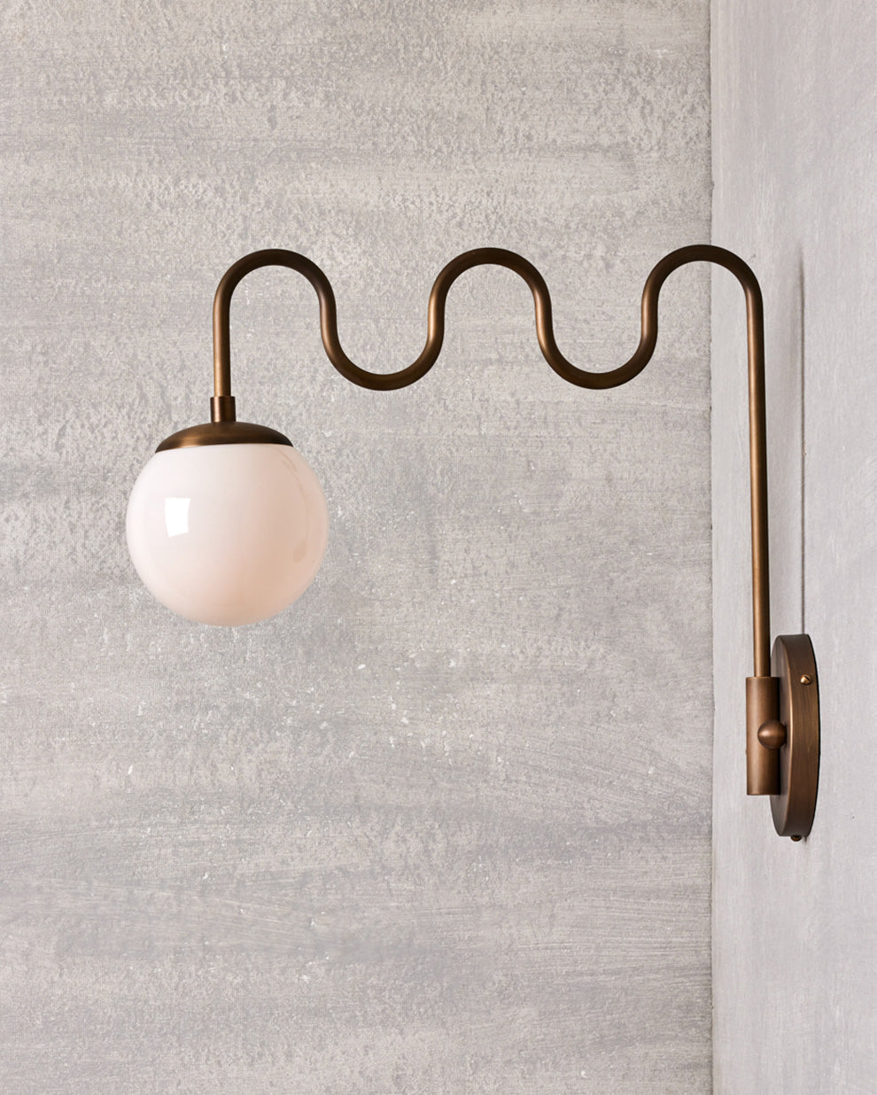 Cecil Wall Lamp – Undulating Bent Brass Arm & Swivel Glass Globe Sconce