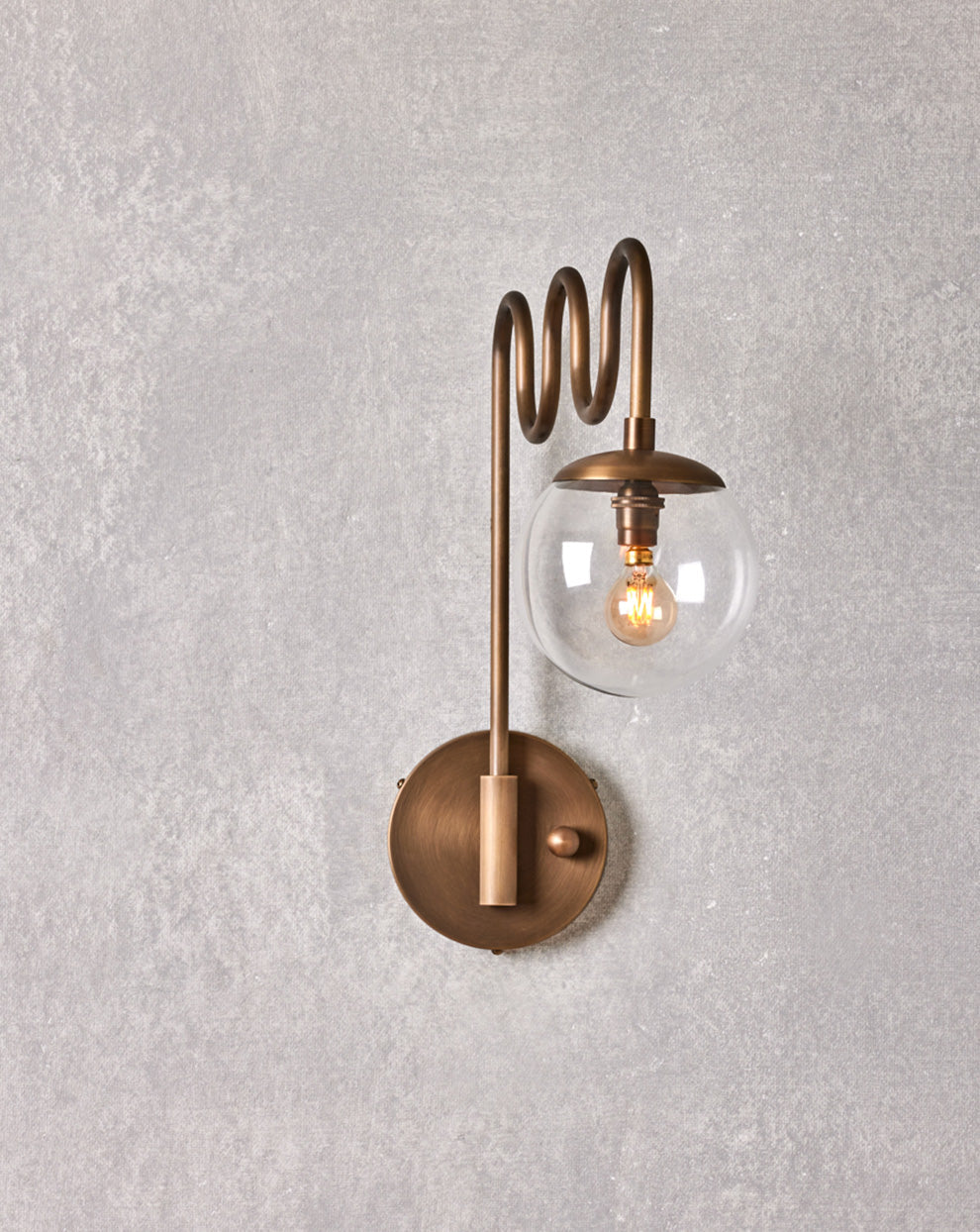Cecil Wall Lamp – Undulating Bent Brass Arm & Swivel Glass Globe Sconce