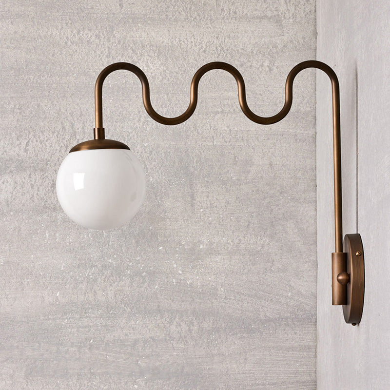 Cecil Wall Lamp – Undulating Bent Brass Arm & Swivel Glass Globe Sconce