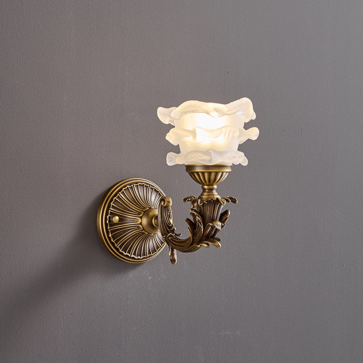 Darwin Wall Lamp – Antique Brass Curved Arm Sconce with Floral Glass Shade