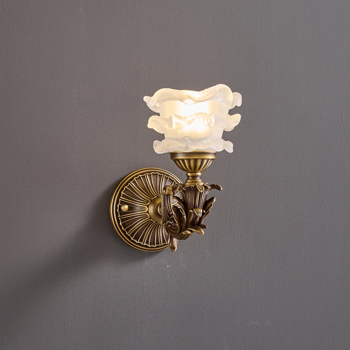 Darwin Wall Lamp – Antique Brass Curved Arm Sconce with Floral Glass Shade
