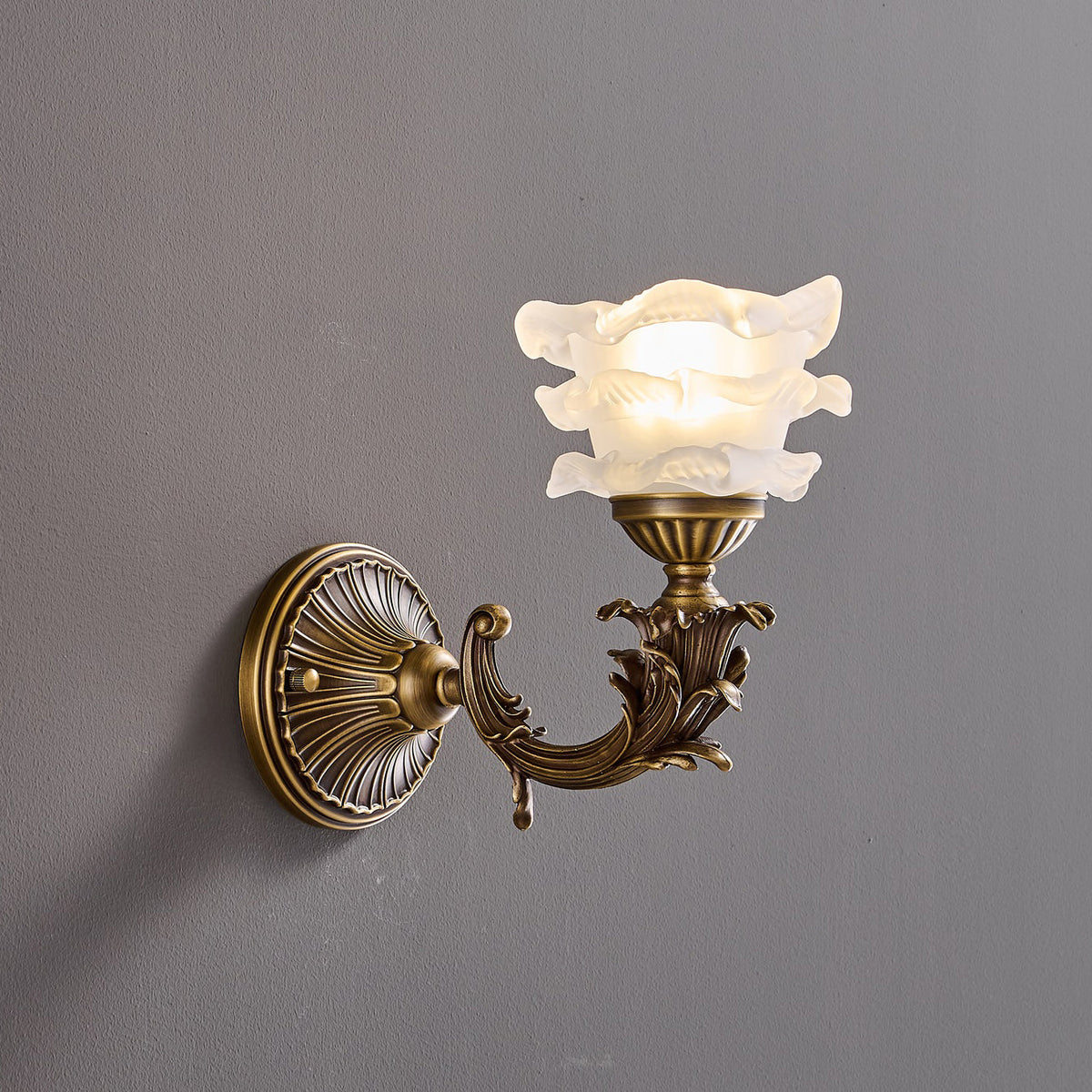 Darwin Wall Lamp – Antique Brass Curved Arm Sconce with Floral Glass Shade