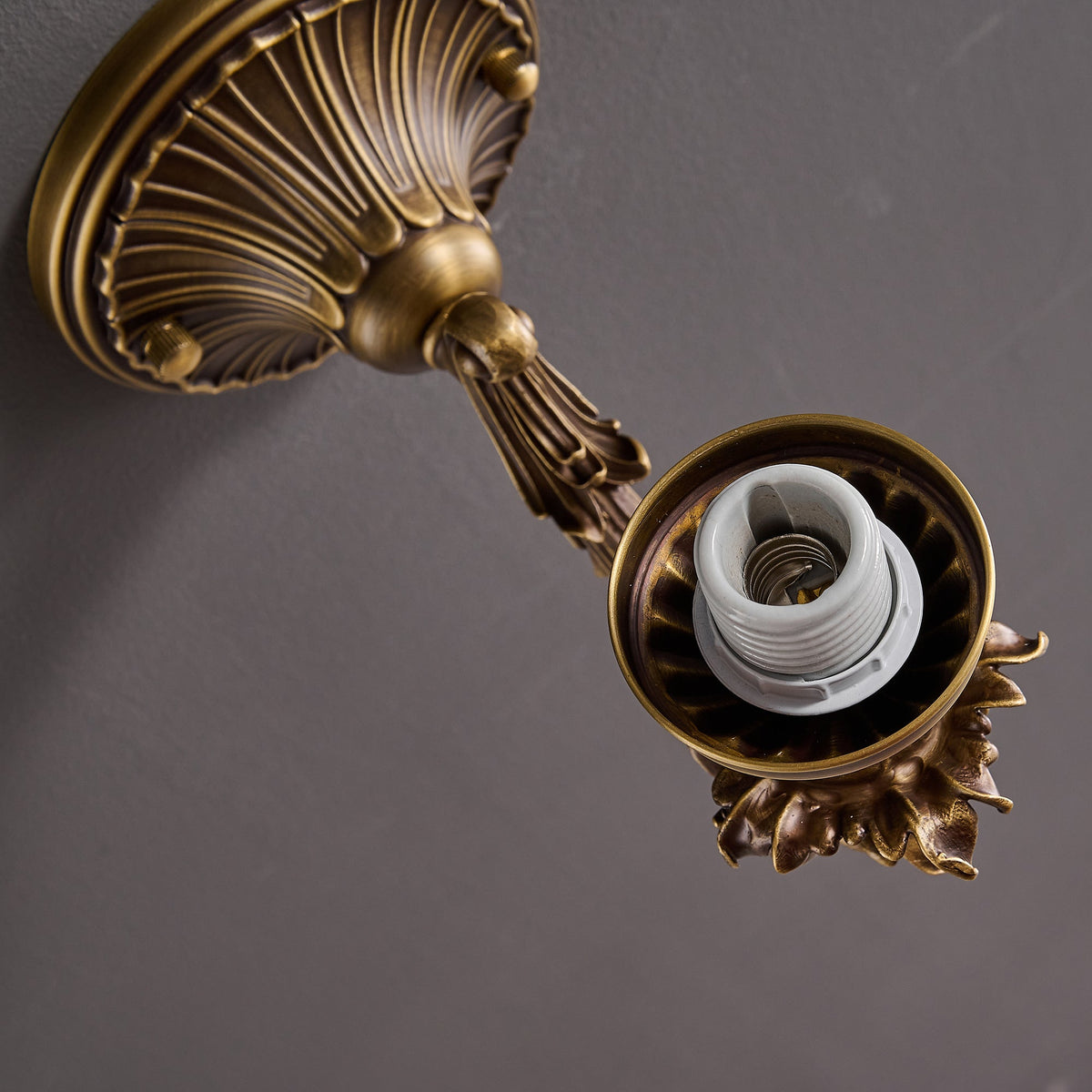Darwin Wall Lamp – Antique Brass Curved Arm Sconce with Floral Glass Shade