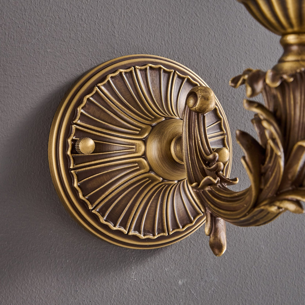 Darwin Wall Lamp – Antique Brass Curved Arm Sconce with Floral Glass Shade