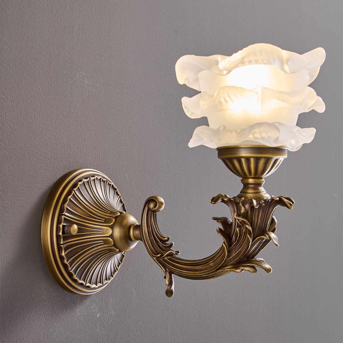 Darwin Wall Lamp – Antique Brass Curved Arm Sconce with Floral Glass Shade