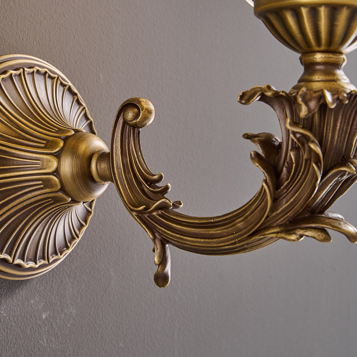 Darwin Wall Lamp – Antique Brass Curved Arm Sconce with Floral Glass Shade