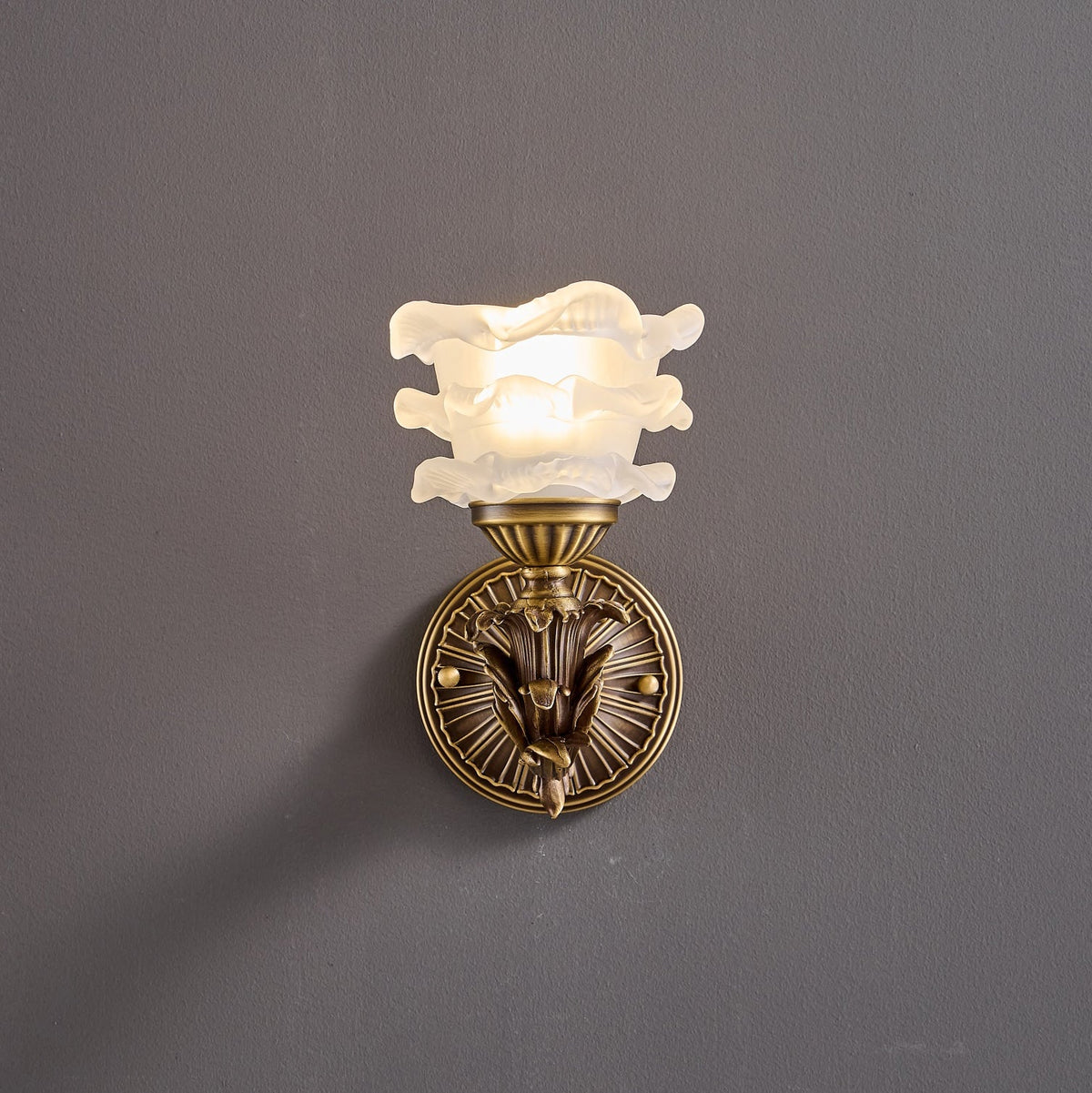 Darwin Wall Lamp – Antique Brass Curved Arm Sconce with Floral Glass Shade