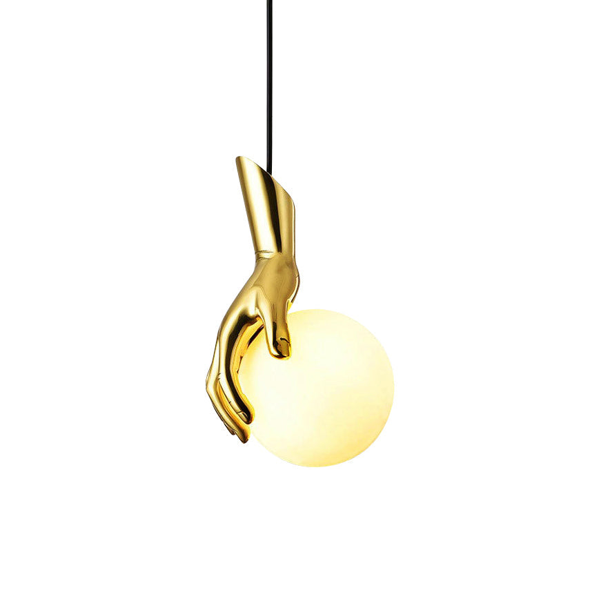 Hand Holding Globe Pendant Light - Sculptural Brass Hand & White Glass Orb Pendant